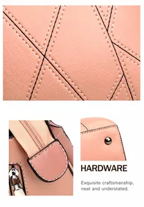 Detailed macro of pink pebbled leather handbag with hardware studs and zippers