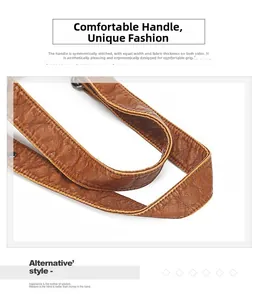 Detail of ergonomic wide leather handle with reinforced stitching and pebble texture