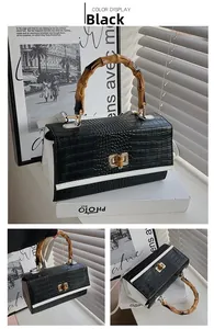 Vue détaillée du sac à bandoulière motif crocodile avec poignée en bambou et dorure