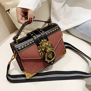 Vintage rivet crossbody bag with lion head clasp and black-white stripe wide strap