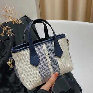 Bolso tipo cubo de lona para mujer con diseño de rayas de colores y correa ajustable