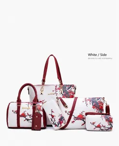 Detail of 6-piece handbag set featuring elegant plum blossom print in white and burgundy