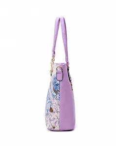 Side view of purple tote bag with ethnic floral print and golden metal zipper detail