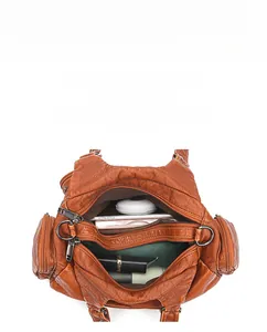 Internal view of a brown vintage tote showing large capacity and multi-pocket layout
