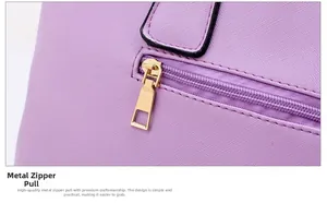 Close-up of golden metal zipper and textured purple leather on Chinese style handbag