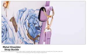 Detail of light gold swivel hook and D-ring on purple crossgrain leather floral bag