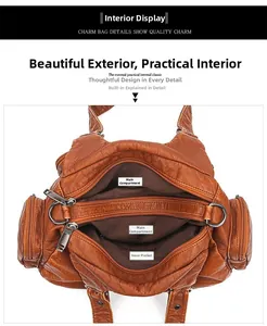 Detailed interior of brown soft leather handbag with dual main compartments and zipper pockets