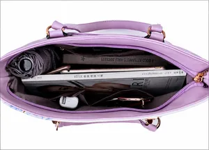 Internal display of lavender tote bag showing spacious compartments and daily essentials