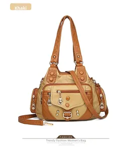Detail view of khaki PU leather tote bag with multi-pockets, rivets, and metal rings