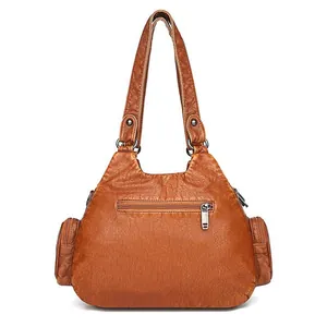 Caramel brown washed leather crossbody handbag for women with multi-zipper pockets