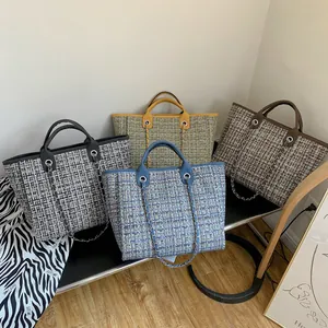 Quilted tote bags in four colors with leather handles and metal chain details