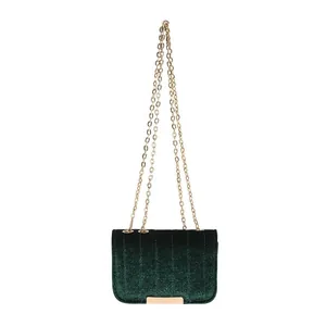 Deep dark green velvet chain crossbody bag with vertical quilting and gold hardware