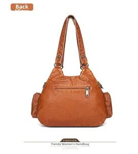 Detailed back view of brown wash leather tote bag showing zipper pockets and straps