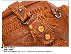 Detailed macro view of the gold-tone hardware buckles and lychee leather texture