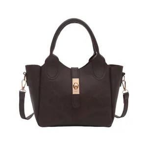 Deep brown retro textured bucket bag with dual handles and gold metallic clasp