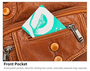 Detailed view of the brown leather front patch pocket for convenient card storage