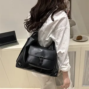 Black large capacity vintage tote bag made of matte leather with front buckle pocket
