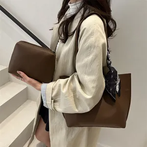 Deep brown tote bag set with matching pouch and decorative geometric silk scarf