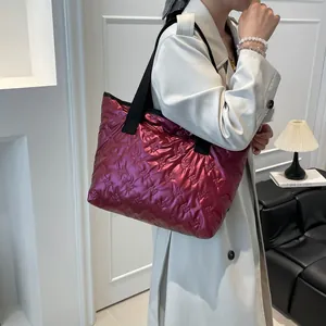 Magenta pleated tote bag with 3D rabbit embossing and wide black shoulder strap
