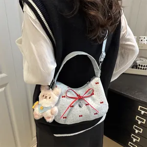 Pink bow crescent bag with red floral print and cute teddy bear charm accessory