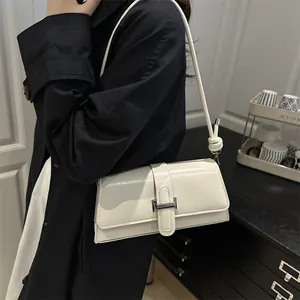 Creamy white PU leather baguette bag with silver buckle and knotted shoulder strap