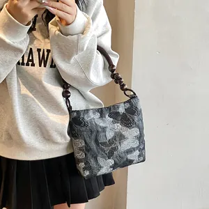 Retro graue Schultertasche mit Schmetterlingsmuster und Perlengriff im Bambusstil