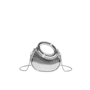 Silver metallic pleated dumpling bag with round handle and detachable chain strap