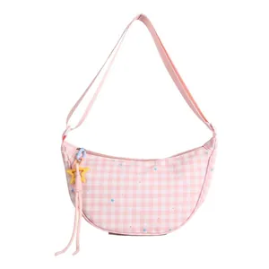 Chic pink plaid crescent shoulder bag with colorful star prints and tassel charm