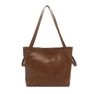 Minimalist caramel brown PU leather tote bag with unique diagonal stitching for women