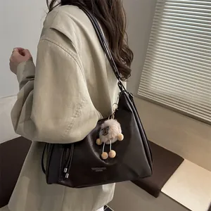 Large capacity dark brown leather tote bag with plush charm and fashion branding