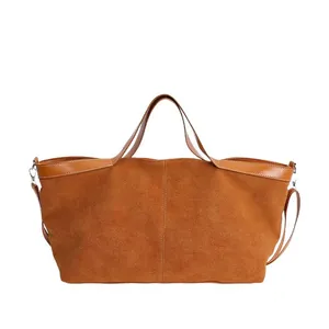 Minimalist large brown suede tote bag with smooth leather handles and shoulder strap