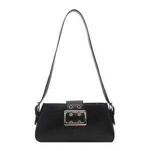 Vintage black faux leather baguette shoulder bag with a large silver buckle detail