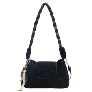 Black leopard texture crossbody bag with woven strap and colorful bead ornament