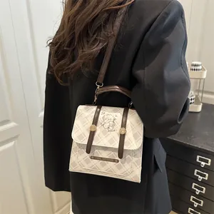 Sac à dos à carreaux pour étudiantes avec motif chien mignon et détails en cuir marron