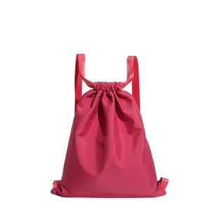Magenta drawstring bucket backpack in lightweight nylon with wide straps for daily sports