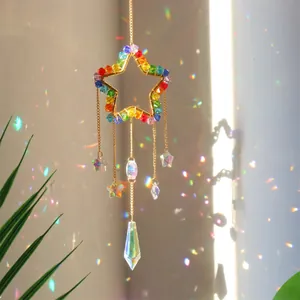 Rainbow star suncatcher with K9 crystal prisms reflecting colorful light on wall