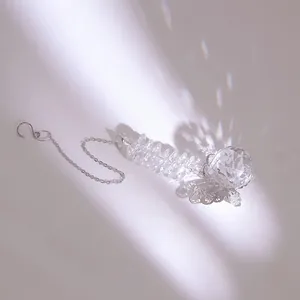 K9 crystal suncatcher with butterfly ornament and faceted ball creating rainbow light effects