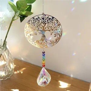 Golden Tree of Life suncatcher with chakra beads and crystal prism casting rainbow light