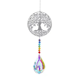 Detail of tree of life suncatcher with chakra beads and faceted crystal prism pendant