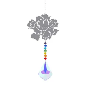 Detailed view of metal flower suncatcher with rainbow beads and AB crystal prism pendant