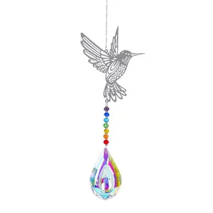 Detailed view of silver hummingbird suncatcher with rainbow beads and crystal pendant