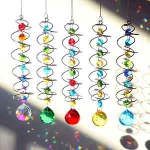 Set of 5 3D crystal suncatchers with spiral metal tails creating vibrant rainbow light