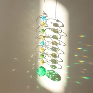 Macro detail of crystal suncatcher spiral with glass beads reflecting rainbow light