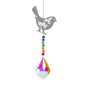 Detail of silver hummingbird suncatcher with colorful beads and crystal raindrop prism
