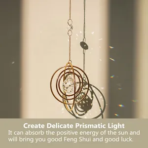 Detail of crystal suncatcher casting rainbow prism reflections on a wall under sunlight
