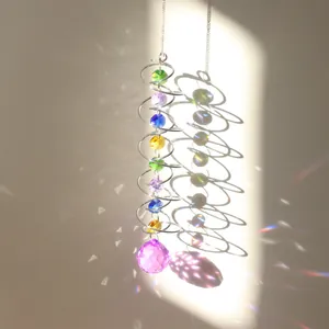 Detailed view of 3D spiral suncatcher with colorful beads and purple crystal pendant