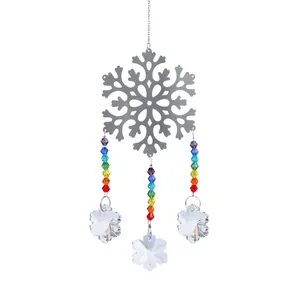 Macro detail of silver metal snowflake with rainbow crystal beads and K9 crystal pendants