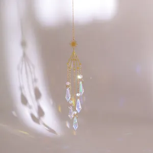 Golden suncatcher with celestial sun charms and rainbow prism crystals for garden decor
