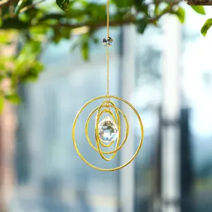 Golden galaxy solar suncatcher with tiered metal rings and faceted crystal prism pendant