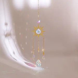 Bohemian suncatcher with golden sun and moon metal frames featuring crystal prisms